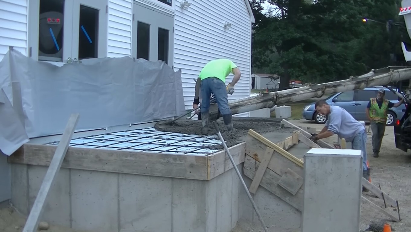 Professional concrete contractors working on foundation in State College, PA